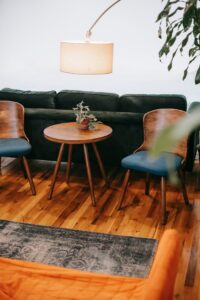 Bright room interior with furniture under lamp in house